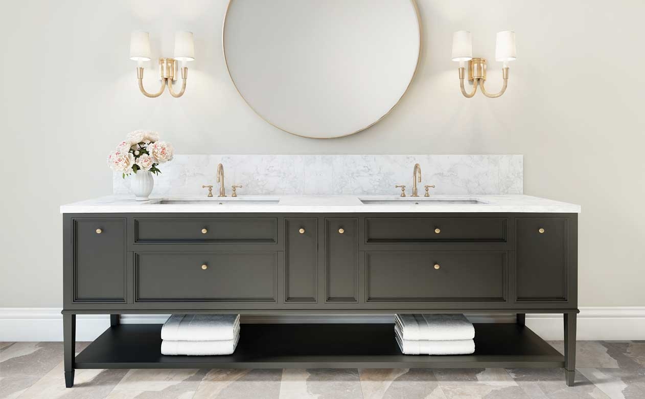 stone look floors in bathroom with dark brown vanity and marble stone countertops with brass fixtures